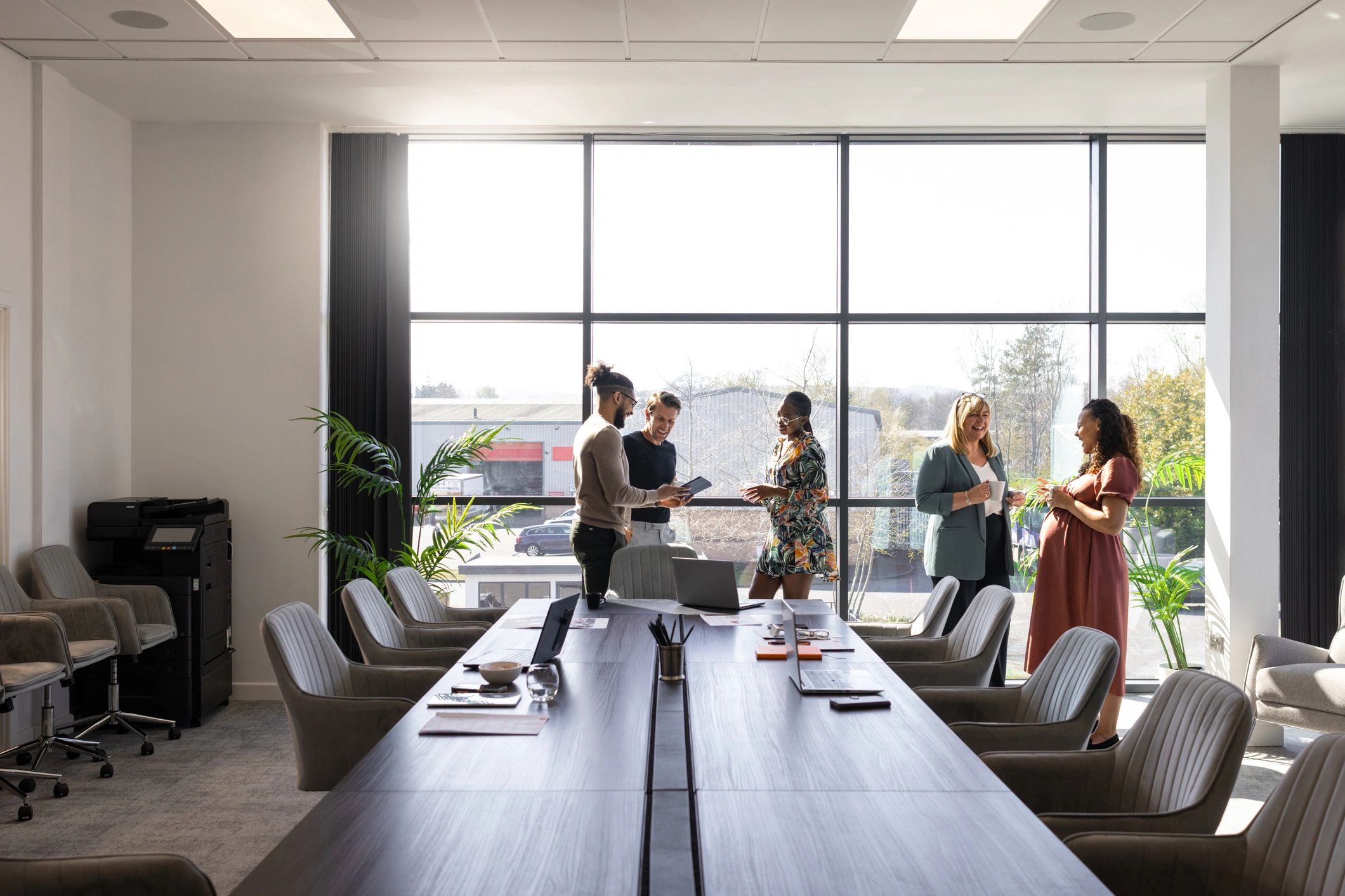 Business team discussing AI strategy in a modern office